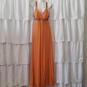 Mikael Aghal orange prom dress with sequins strap